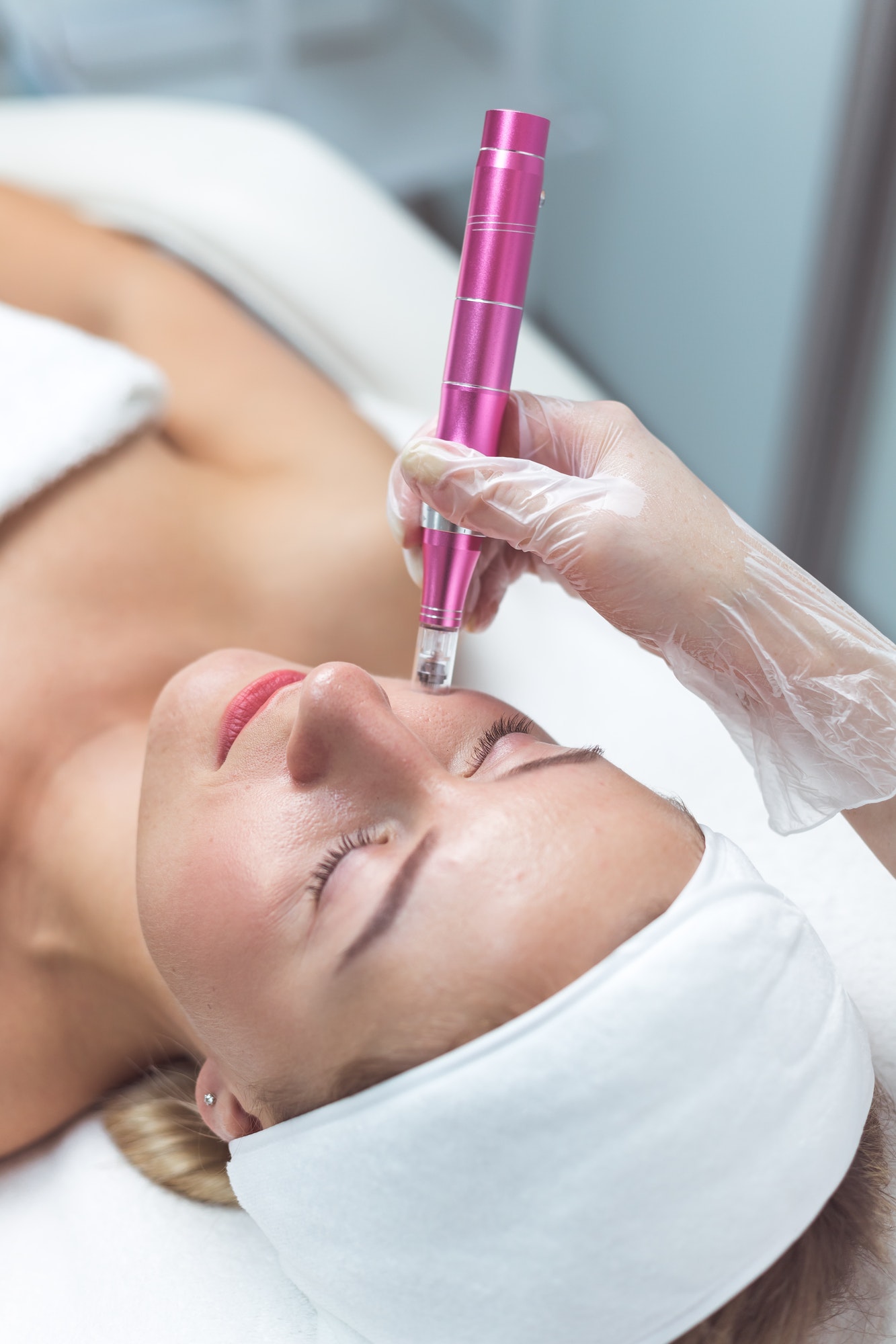 Woman having facial treatment in beauty salon, closeup. Oxy derma therapy
