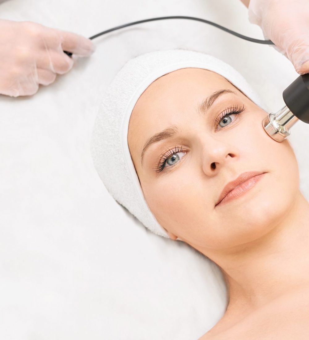 Electroporation woman face treatment. Facial rejuvenation therapy. Cosmetology skin spa equipment. Rf lifting. Massage device.